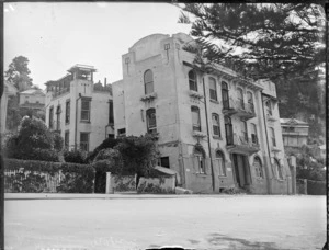 Napier earthquake damage, view of multi-story building having partially collapsed ground floor, leaning back on building behind, Napier waterfront, Hawke's Bay District