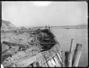 Napier Earthquake, view of Napier wharf damage to retaining wall, with men inspecting the situation, Napier, Hawke's Bay District