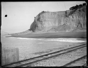 Napier Earthquake, view from wharf looking to Bluff Hill with slip debris covering Breakwater Road below, Marine Parade beyond, Napier, Hawke's Bay District