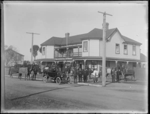 Group of men out front of the Stortford Lodge Hotel with horses and car, Hastings, Hawke's Bay District