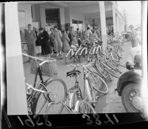 Bicycles parked on street and footpath, [Kimbolton Street?], Feilding, Manawatu-Whanganui Region
