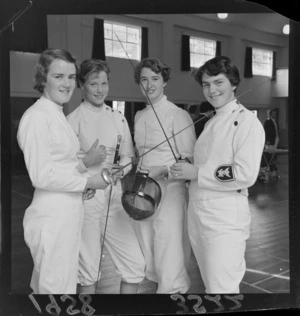 College students, in fencing uniforms, with rapiers and gear, Wellington