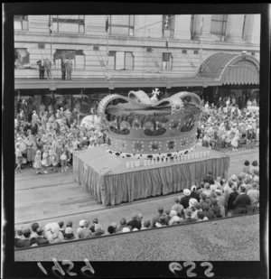 Festival of Wellington parade, showing New Zealand Government parade float, and spectators outside the DIC building, Lambton Quay, Wellington