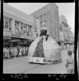 Festival of Wellington parade, showing Drapery and General Importing Company of New Zealand Ltd parade float, and spectators, Wellington