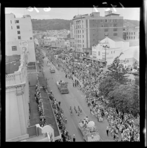 Dixon Street, Wellington, looking towards Mount Victoria, during Festival of Wellington parade, showing parade floats, spectators, and buildings including Kings Theatre