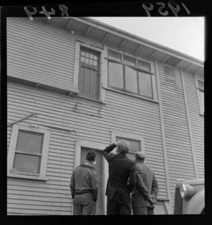 Unidentified men inspecting the Aero Club building at Rongotai, Wellington