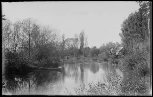 Pond or river with a rowing boat and ducks; a stone building is in the background, unknown location