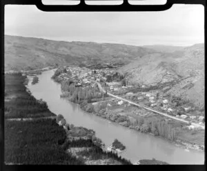 View of Roxburgh, Central Otago, within the Clutha River Valley, showing Scotland Street (State Highway 8) and pine plantation across river from town