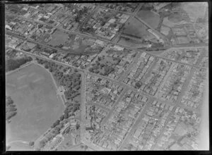 Newmarket Borough, Auckland City, view of Auckland Domain with Carlton Gore Road, Park Road and Auckland Public Hospital, Mount Eden Prison, railway line, Auckland Grammar School with fields and netball courts, residential and commercial buildings