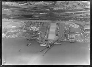 Close-up view of new wharf area under construction, Auckland City, with Quay Street and railway yards beyond