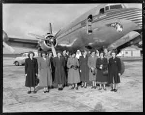 Close-up view of a group of women in front of Pan American World Airways plane, East Indian PAA number 888, Whenuapai, Auckland City