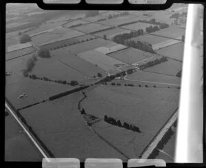 Leamington, Waikato District, view of farmland showing fields with hedgerows, access roads and farm buildings