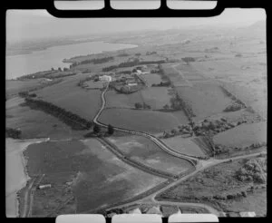 Glendowie, Auckland City, view south from Churchill Park with Riddell Road to Kerridge family home surrounded by farmland, with Panmure and estuary beyond