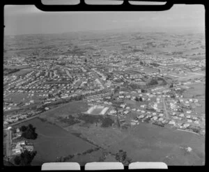 Papatoetoe, South Auckland, view east with residential housing, showing Papatoetoe West Primary School and Kohuora Park, Hillcrest Road and Station Road and railway station, farmland surrounding