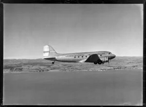 New Zealand National Airways Corporation (NAC) Flagship Dakota aircraft in flight over Auckland