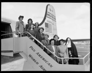 Unidentified group next to Pan American Airways aircraft at Whenuapai airport, Auckland