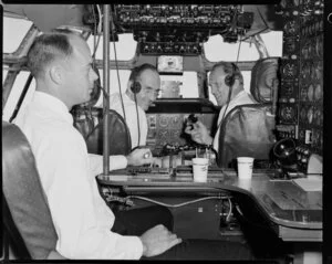 Pan American World Airways, crew in cockpit of Boeing 377 stratocruiser, Clipper Rainbow, flight to Christchurch, Whenuapai, Auckland