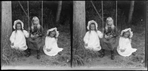 Two little girls in bonnets and another on a swing, Brunswick, Wanganui Region