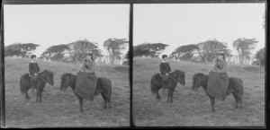 Unidentified girl and boy riding ponies (with girl riding side-saddle) Catlins area, Clutha District, Otago Region