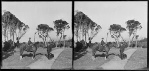Unidentified boy on horseback, with elderly man at the head of the horse, Catlins area, Clutha District, Otago Region, also including dog