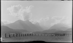 Fenced farmland, with mountains in the distance [Fiordland National Park?]