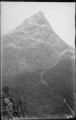 Snowy mountain with waterfall, [Fiordland National Park, Southland District?]