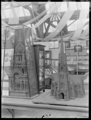 Advertising exhibit of the Anglican Cathedral Church with a clock in a glass case at the New Zealand and South Seas International Exhibition in Dunedin