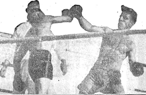 PETE KNOCKS TOM'S RIGHT LEAD AWAY. How the American could have ripped his left had it been sound! (NZ Truth, 03 April 1930)