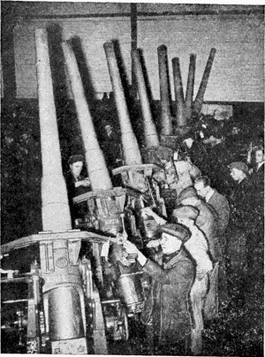 GUNS FOR THE MERCANTILE MARINE: High angle guns for use in the Mercantile Marine are seen foeing prepared for despatch from the factory. (Ellesmere Guardian, 23 August 1940)