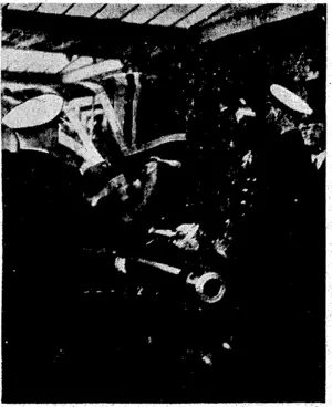 Captain W. E. Parry, C.8., commander of H.M.S.' Achilles, covering the-coffin of'the late Prime/Minister with the New Zealand ensign which ivas flown' by the 'Achilles in the battle with^ the. Admiral Graf Spec. (Evening Post, 01 April 1940)