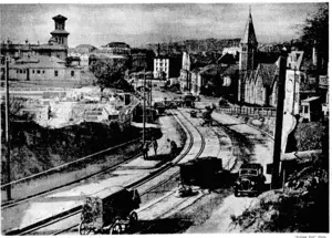 The work of-, laying the new double line of tramway tracks from Tinafcori Road to Lambton Quay has now advanced to the corner of Wellington Terrace arid Bdwen Street: This picture shows the present . state of the undertaking. (Evening Post, 09 May 1940)