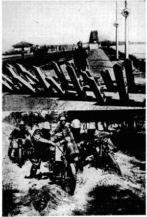 Sport &nd /General" Photo; , The top, pictureshows the "asparagus beds*I'of raijs.in concreteIpits'that were \crectied along-the,,German^ frontier by'the• Dutchin: fear of theinvasion ivhich has now begun: Below are Netherlands troops with machine-guns on motor-cyples. (Evening Post, 11 May 1940)