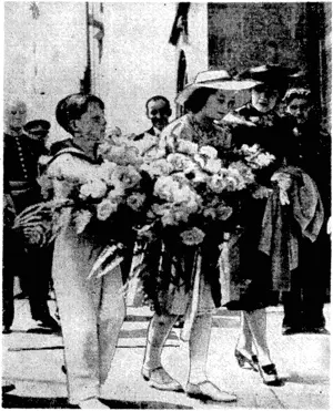 Kosmoa Photo. Crown Prince Baudouin and Princess Josephine Charlotte, children of Leopold 111, King of the Belgians, visiting a town in East Flanders to place flowers on the war memorial. (Evening Post, 11 May 1940)