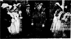 Her Majesty Queen Mary recently visited the hospital supply head" quarters in the West Country. She is seen leaving between members of a guard of honour from the Red Cross Women's Detachment. (Evening Post, 11 May 1940)