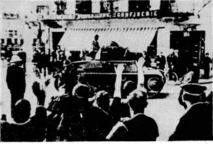 I "Sport, and General" Photo. People in the streets ■ cheering the arrival of 'French ■ tanks in a Belgian town. ■■ ''. .... (Evening Post, 04 June 1940)