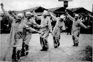 British Official Photo. Punjabi dancers taking part in an Indian gymkhana held to entertain local inhabitants near their camp in France) The dancers, who are members of the Indian Army of the 8.E.F., carry a kind of castanet in their hands, consisting of pieces of tvood with belsl on them. (Evening Post, 12 June 1940)
