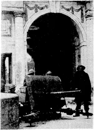 The Menin Gale, famous memorial of the lasf.tvar, used .as a British "nil-tank gun post. . (Evening Post, 26 June 1940)