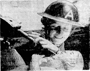 Miss Marjorie. Nicol-Smith carving a statue of Noah in wood. She is an A.R.P. worker, and in her idle moments, when other girls are knitting, she is carving. (Evening Post, 06 July 1940)