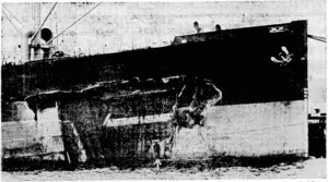 X "Evening Post" Photo. The hole in the side of the British motor-ship Armadale, damaged off Cape Campbell last night in a collision with a Norwegian tanker. Its size is indicated by comparison with a man standing on a raft inside the hole, an arrow showing his position. (Evening Post, 01 August 1940)