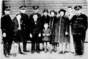 Evening Post" Photo. Salvationists and their families who have arrived in Wellington from overseas, and ivho were officially met by the New Zealand Commandant, Commissioner J. Evan Smith. Back row, from left. Brigadier A. Robinson, neio Financial Secretary for New Zealand, Commissioner J. Evan Smith, Major Smith, who is a missionary from Korea, Mrs. Smith, Mrs. Robinson, Miss Olive Robinson, Master B. Smith, and Brigadier Greene, who also welcomed the party. In front, Masters, C. Robinson and S. and C. Smith. (Evening Post, 03 September 1940)