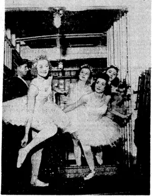 Midnight Chtistmas celebrations on board one of the French battleships for the entertainment of some fortunate British sailors. One of the features of the_ entertainment was a ballet to music by Chopin danced by Mile. Marie-Louis Didion and ballet chorus from the Paris Opera. Some members of the ballet are seen coming through one of the ship's hatches, which gave them access from dressing\ rootn to "stage." (Evening Post, 27 January 1940)