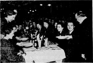 Sirv IdngsleyWood'handing out the first plate of soup at Christmas lunch to members of the Women*s Auxiliary Air Force at a fighter squadron base near London. The Air Secretary spent most of 'Christmas Day doing a round of the fighter squadrons and inspectirig the Christmas, arrangements. (Evening Post, 27 January 1940)