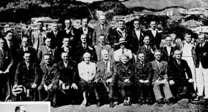 i "Evening; Post" Photo. At the track and field championships at the Basin Reserve on Saturday, when New Zealand's leadingathletes assembled to contest Dominion titles. Top left, the Governor-General, Lord Galway, with the Hon. W. E. Parry and the Hon. P. Fraser. Above, past New Zealand champions who were the guests of the Wellington Centre and who took part in the parade of athletes. Extreme left, P. F. Sharpley, winner of the 120yds hurdles, on the victory stand with L. C. Woodward and C. R. Bradwell, who finished second and third respectively. Left, V. P. Boot taking the oath of amateurism from a dais on behalf of the assembled athletes. (Evening Post, 11 March 1940)
