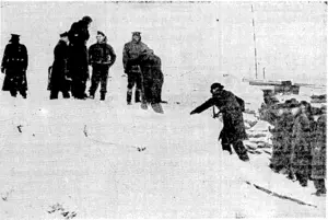 Wintry conditions on the Western front on January 27, when Empire Press correspondents ivere making a tour of an air-field. Flying-Officer E. J. Kain, of Wellington, ivhose exploits have frequentlyfigured in the cable news, is facing the camera, fourth from the left. (Evening Post, 11 March 1940)