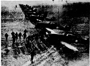Pilots at an R,A.F. fighter aerodrome in France race to their aircraft when warned of the approach of enemy planes. , (Evening Post, 19 March 1940)