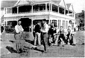 Evening Post" Photo. Competitors and caddies at the first tee outside the clubhouse at Heretaunga today ivhen the semifinalists in the provincial golf championship started out. The two players in the foreground are J. B. Parker (left) and A. T. Clelland. The other two semi-finalists—W. B. Reilly and J. L. Black—have just driven off, and the two players in the picture are waiting for them to get clear. (Evening Post, 26 March 1940)