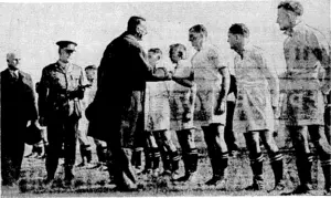 Evening Post" Photo. Players in the South Island team being introduced to the Governor-General Lord Galway, prior to the inter-Island Services match at Athletic Park last Saturday.- Mr. S. S. Dean, chairman of the manage* ment committee of the N.Z.R.F.U., is on the extreme left. (Evening Post, 05 October 1940)