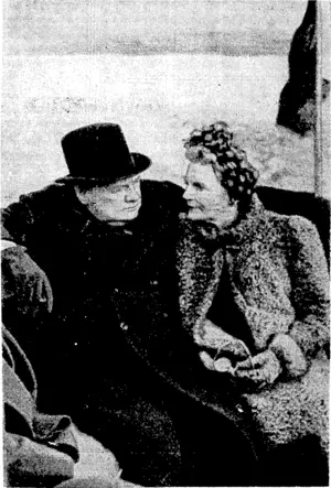 Fox Photo. The Prime Minister and Mrs. Churchill made a tour, of [the London docks on September 26. Mr. Churchill, though, he has a froWn, does not look unduly worried. (Evening Post, 18 October 1940)