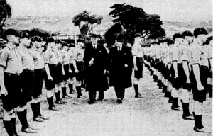 Evening Post" Photo. The Prime Minister, the Rt. Hon. P. Fraser, accompanied by the headmaster, Mr. W. A. Armour, inspecting the boys of Wellington College yesterday afternoon before they entered the Memorial Hall to participate in the "Foundation Day" service. (Evening Post, 18 October 1940)