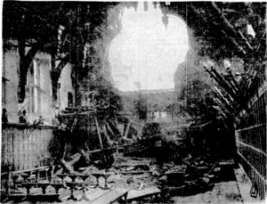 Sport and General" I'hotc. ! Great damage was done to the Middle and Inner Temples during raids on London. A heavy-calibre bomb blew a hole in the wall of the Middle Temple Hall (above), and debris damaged the wonderful wood for which the hall was famous. Fortunately the valuable stained glass windows had been removed at the beginning of the war. Top right, a Crusader and a Knight > Templar look down on a battered Crusader in the dining-hall of the Inner Temple. (Evening Post, 26 November 1940)